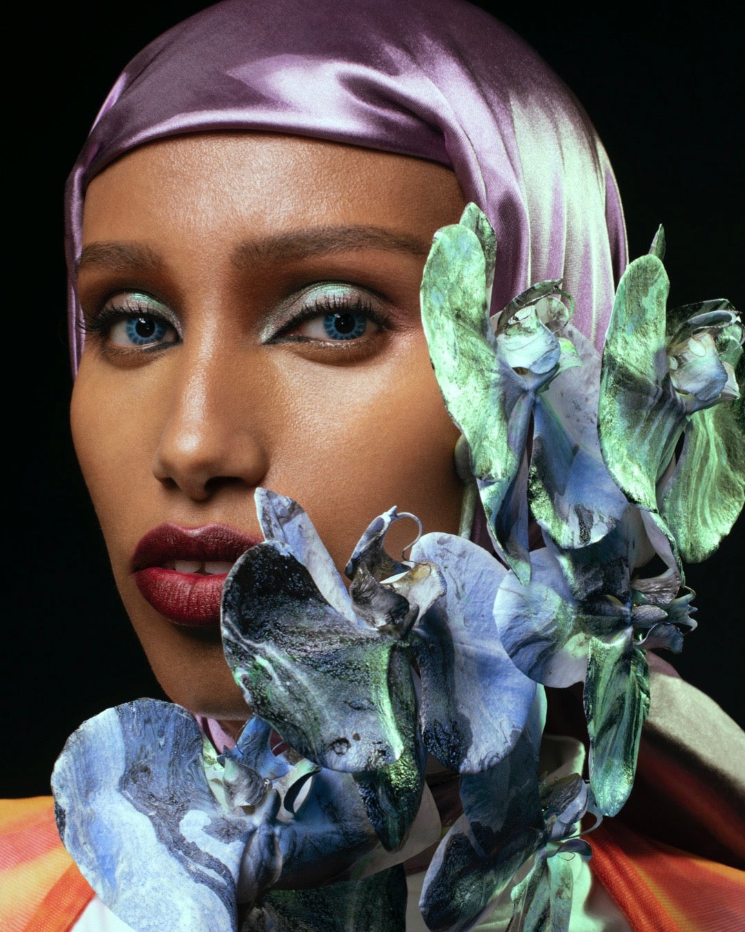 Model with Napoleon Perdis makeup with blue Acid Flwrs